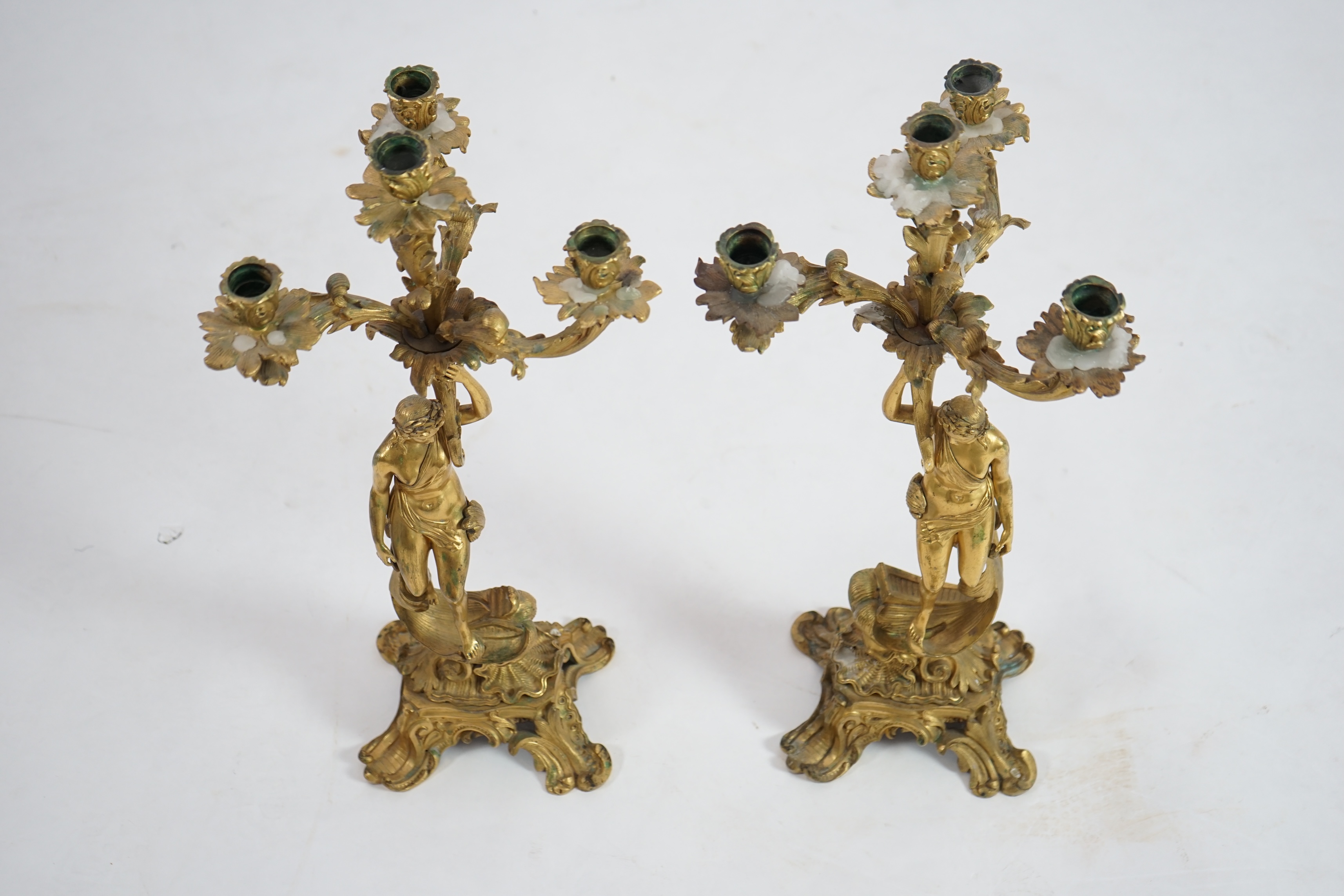 A pair of 19th century French ormolu five light ‘Venus’ figural candelabra